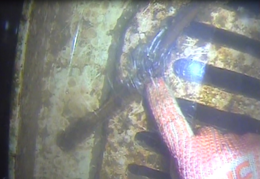 underwater survey checking STBD seachest.