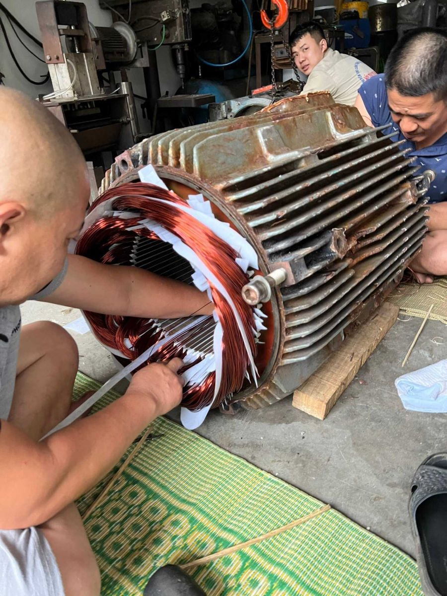 Image of re-winding stator at Workshop.